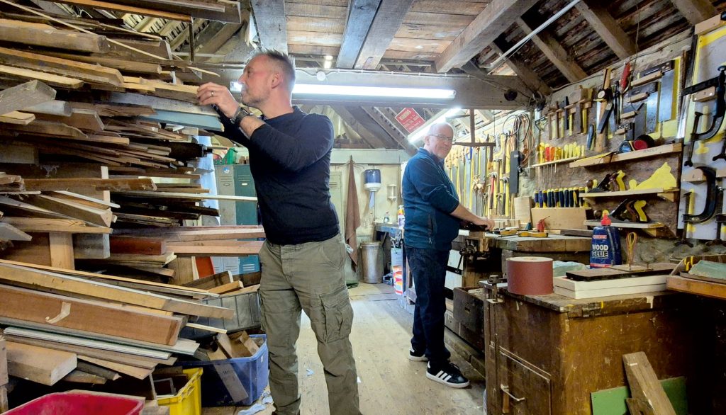 Leighton Buzzard Men In Sheds featuring crowded shed with two men working